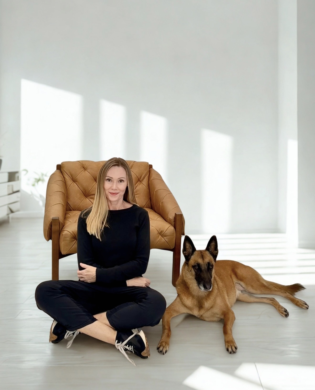 Julie seated with Lana5 in a sunlit studio